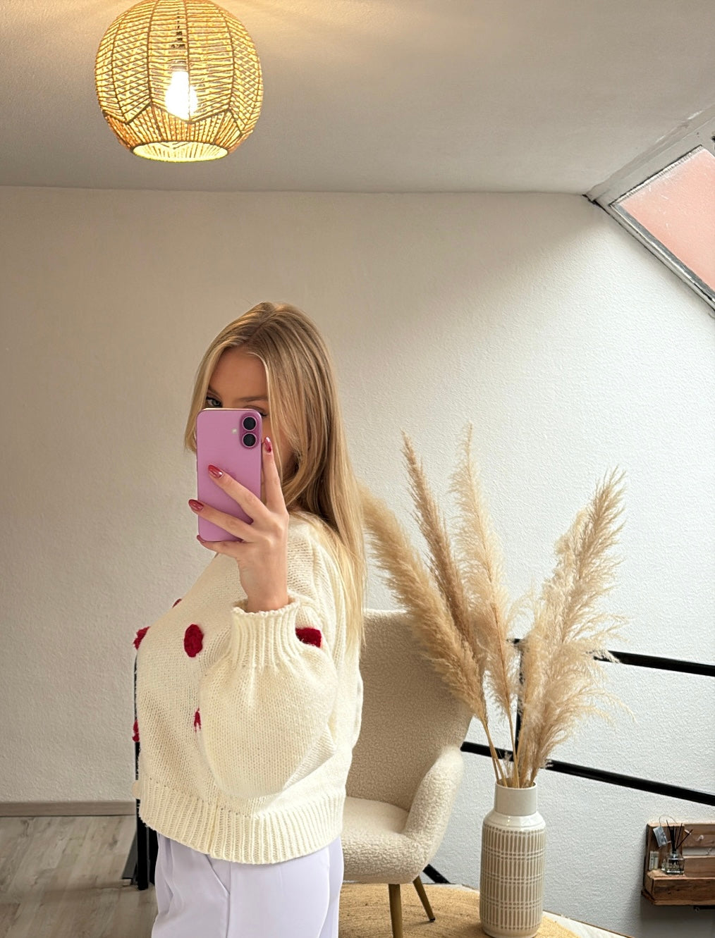 Witte cardigan roosjes