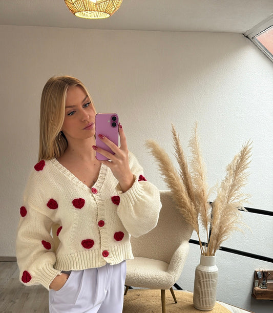 Witte cardigan roosjes