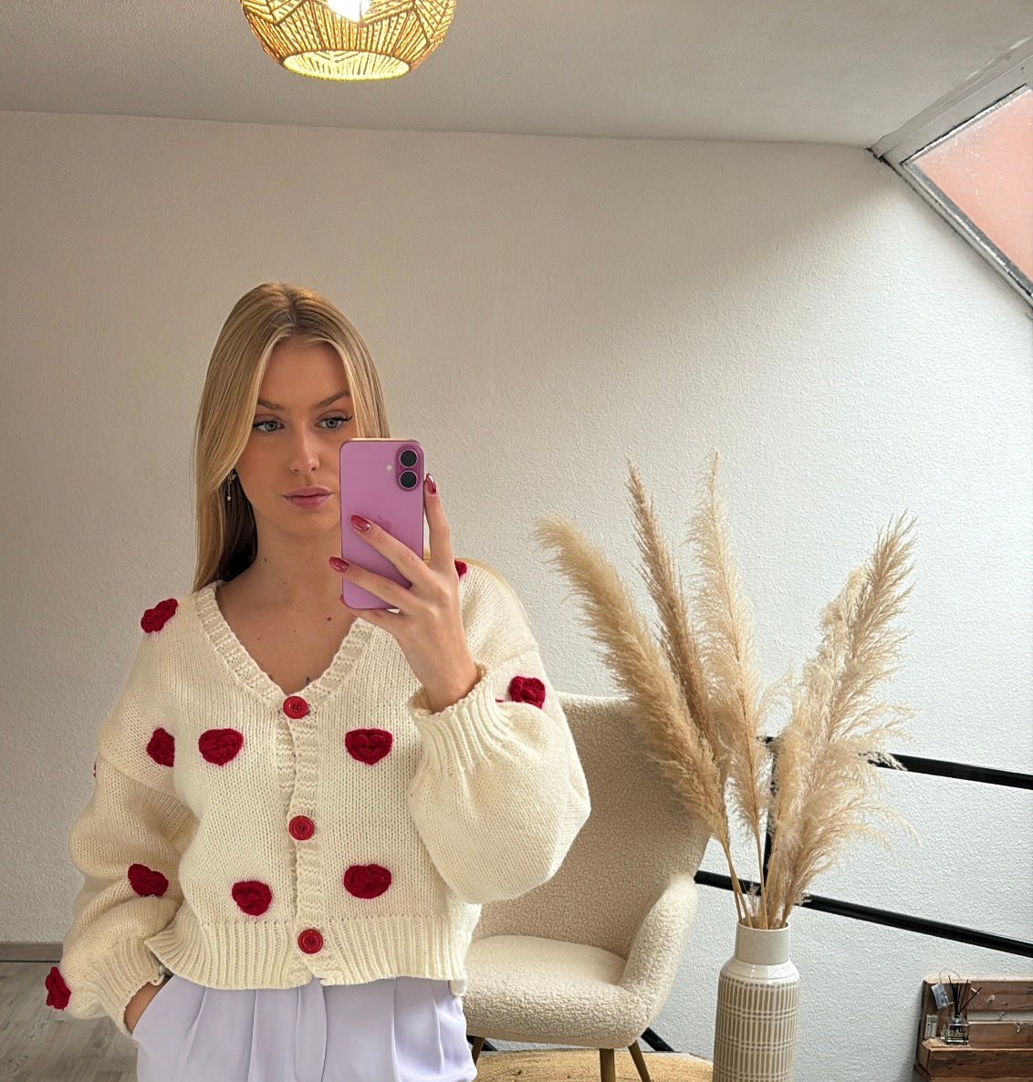 Witte cardigan roosjes